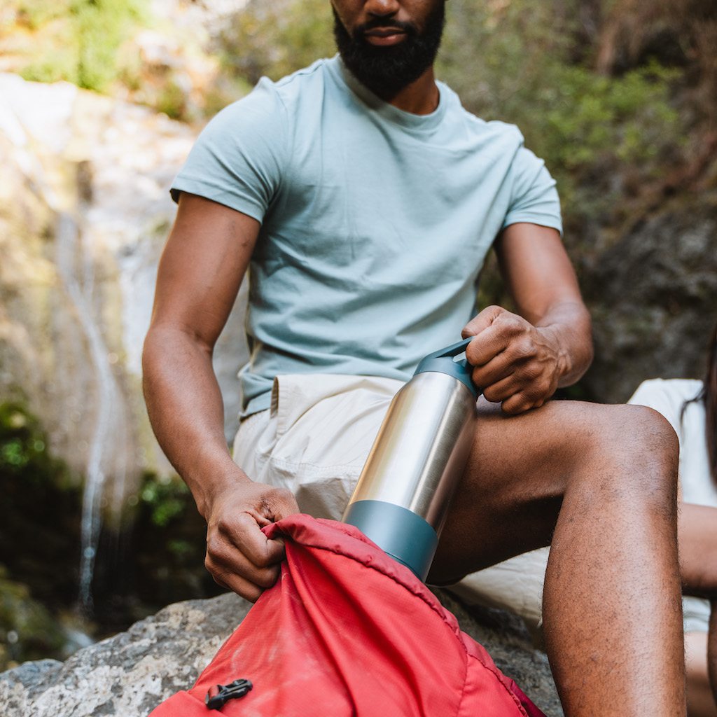 https://www.rapidpurewater.com/cdn/shop/products/0160-0124_Rapidpure_Purifier_and_Insulated_Bottle_in_backpackLifestyleImage3_KrakedandCropped1024px_1024x.jpg?v=1648602443